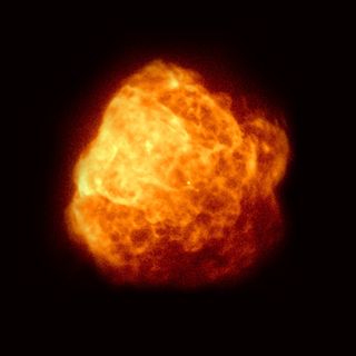 A view of a yellow and orange cloud, slightly blurred in space.